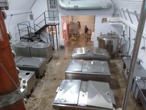 from the upper level, one can look into the Perlick distilling room below