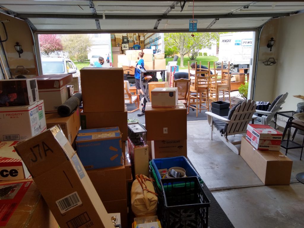 Inside of a garage that is filled with our worldly possessions, prior to moving day!
