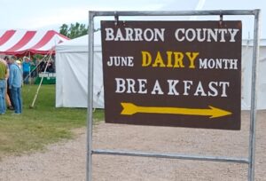 Sign leading the way to the June Dairy Breakfast