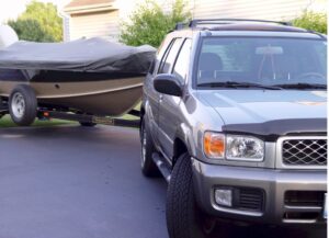 Nissan Pathfinder getting ready to tow a Lund fishing boat