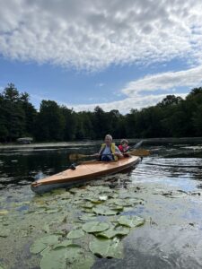 man and boy in kayak on Rice Lake